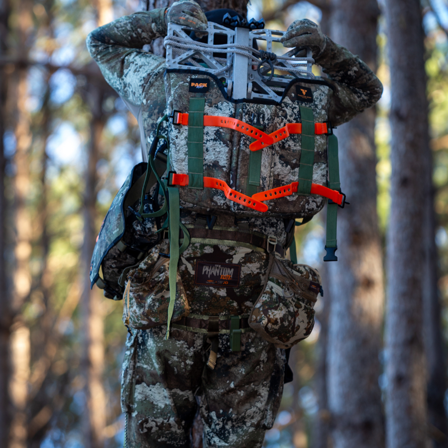 Twisted Iron Hunting Pack Rat Bottomland camouflage hunting pack with multiple compartments and adjustable straps.