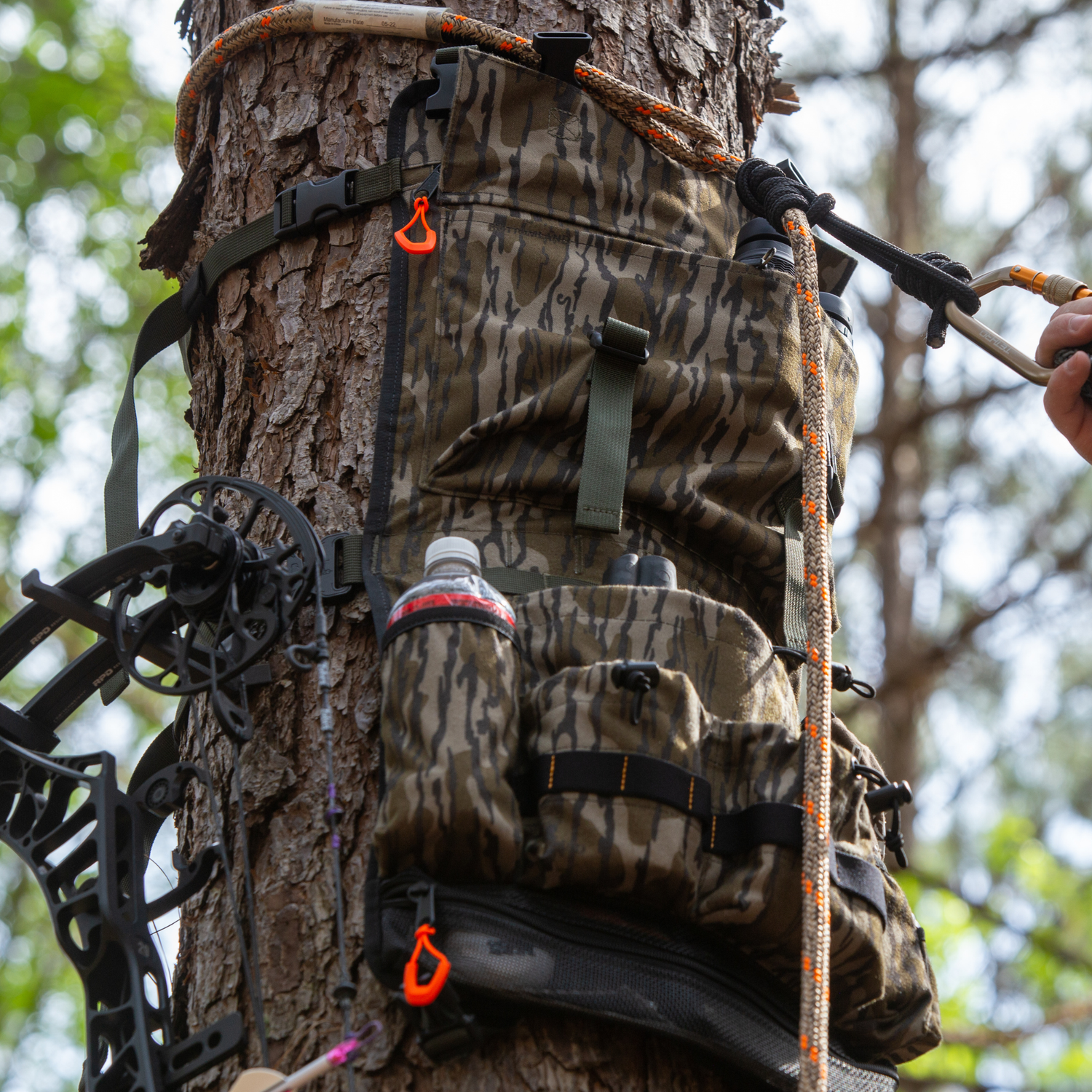 Twisted Iron Hunting Tree Hugger in regular or mini size, featuring durable metal construction and natural tree branch design.