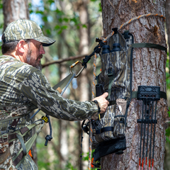 Twisted Iron Hunting Bottomland Tree Hugger camouflage gear in regular or mini size, showing a tree pattern for outdoor concealment.
