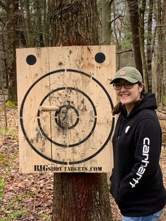 Bigshot Archery wooden axe throwing target with built-in bottle opener for outdoor games and recreational activities.