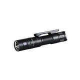 Fenix LD12R dual light EDC flashlight with 600 lumens, compact design, and adjustable focus, shown in a natural outdoor setting.