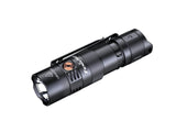 Fenix PD25R rechargeable LED EDC flashlight with black body and textured grip, turned on showing a bright beam.
