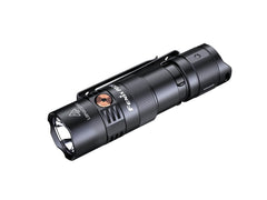 Fenix PD25R rechargeable LED EDC flashlight with black body and textured grip, turned on showing a bright beam.