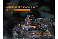 Fenix HP16R rechargeable headlamp emitting bright light, with adjustable strap and compact design for outdoor activities.