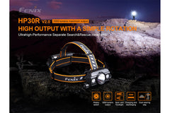 Fenix HP30R V2.0 LED headlamp with 3000 lumens, adjustable strap, and bright white light for outdoor activities and work.