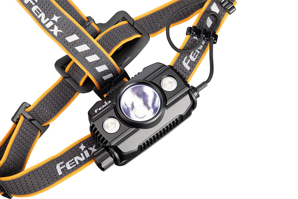 Fenix HP30R V2.0 LED headlamp with 3000 lumens, adjustable strap, and bright white light for outdoor activities and camping.