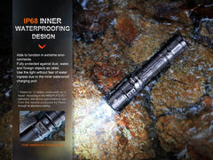 Fenix PD35R compact rechargeable tactical flashlight with adjustable beam and textured grip, suitable for outdoor and tactical use.