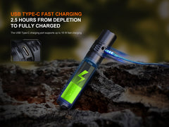 Fenix PD36R V2 tactical flashlight showing its compact design, textured grip, and adjustable focusing lens with bright beam.