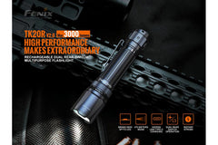 Fenix TK20R V2.0 rechargeable tactical flashlight with black body and textured grip, featuring a removable tactical bezel.