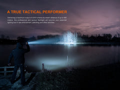 Fenix TK22R rechargeable tactical flashlight with black body, focusing beam, and textured grip for tactical or duty use.