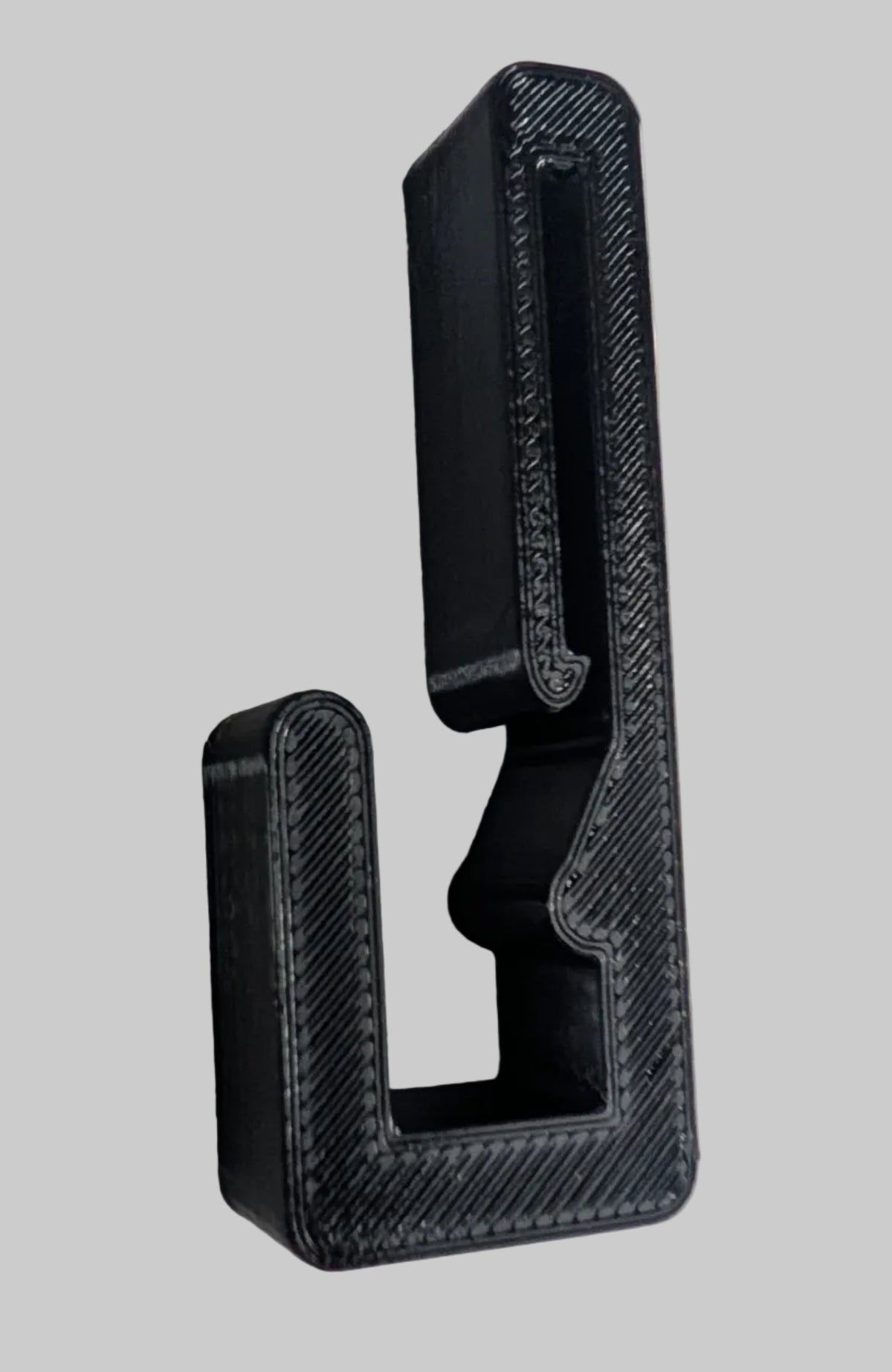 3D Hunting Solutions Saddle Platform Hanger for Mobile Hunting, shown holding hunting gear in a natural outdoor setting