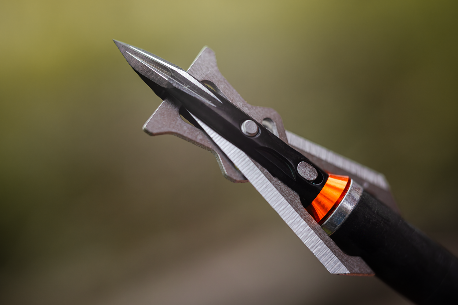 Steel crossbow with Speed Broadheads branding, designed for precision shooting, featuring a sleek metal finish and sturdy construction.